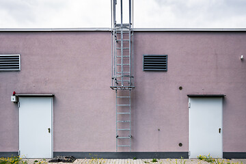 Image showing wall with doors and ladder