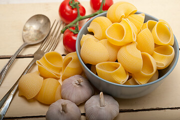 Image showing Italian snail lumaconi pasta with tomatoes