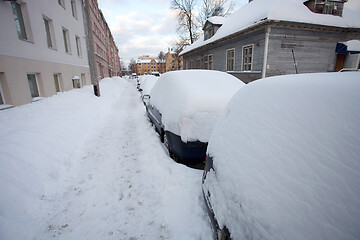 Image showing Snow covered cars