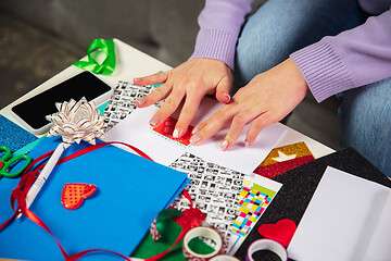 Image showing Woman making greeting card for New Year and Christmas 2021 for friends or family, scrap booking, DIY