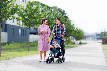 Image showing family with baby in stroller and coffee in city