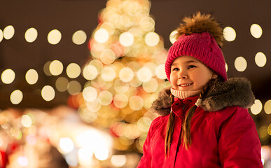 Image showing happy little girl at christmas market in winter