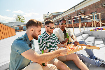 Image showing male friends eating pizza with beer on rooftop