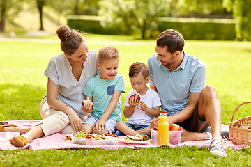 Image showing happy family having picnic at summer park