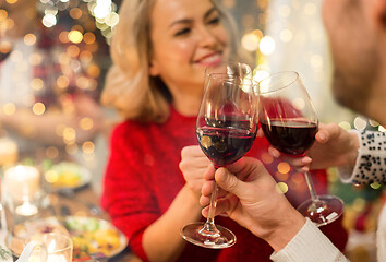 Image showing close up of friends with wine celebrate christmas