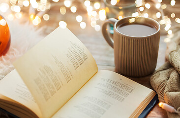 Image showing book and cup of coffee or hot chocolate on table