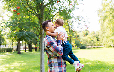 Image showing happy father with little son in summer park