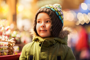 Image showing happy little boy at christmas market in winter