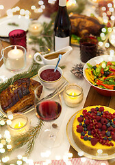 Image showing food and drinks on christmas table at home