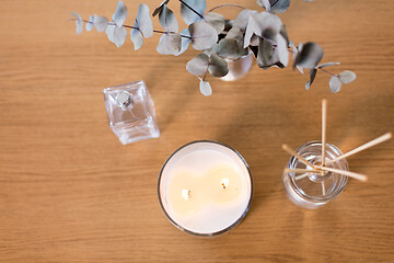 Image showing aroma reed diffuser, burning candle and perfume