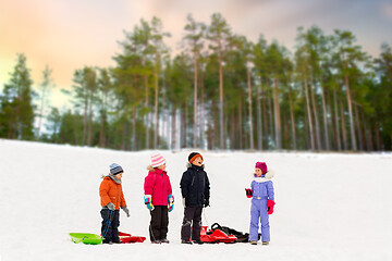 Image showing happy little kids with sleds in winter