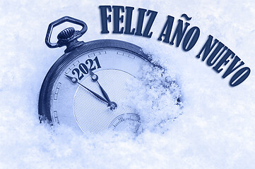 Image showing 2021 greeting card, Happy New Year 2021, in Spanish language, Feliz ano nuevo text, countdown to midnight