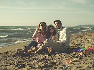 Image showing Young family enjoying vecation during autumn day