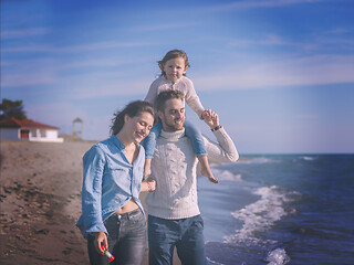 Image showing Young family enjoying vecation during autumn day