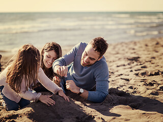 Image showing Young family enjoying vecation during autumn day