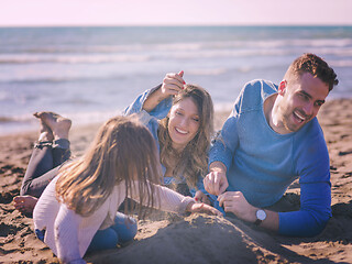 Image showing Young family enjoying vecation during autumn day