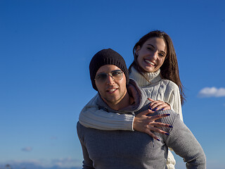 Image showing couple having fun at beach during autumn