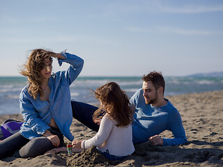 Image showing Young family enjoying vecation during autumn day