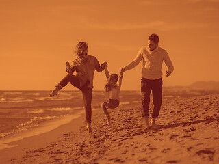 Image showing Young family enjoying vecation during autumn day