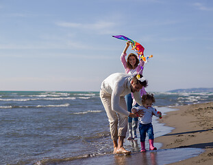 Image showing happy family enjoying vecation during autumn day