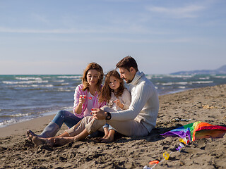 Image showing Young family enjoying vecation during autumn day