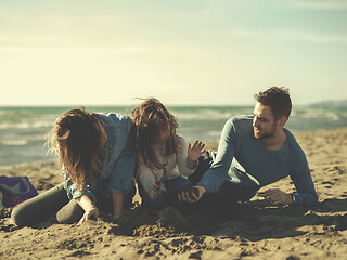 Image showing Young family enjoying vecation during autumn day