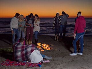 Image showing Friends having fun at beach on autumn day