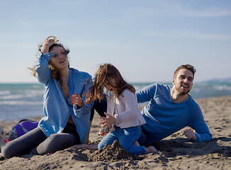 Image showing Young family enjoying vecation during autumn day