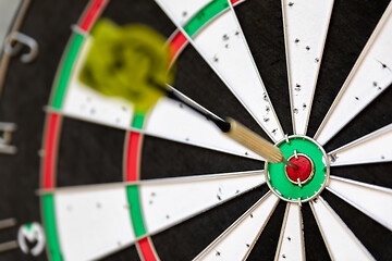 Image showing a typical darts game with dart in the bullseye