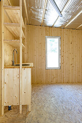 Image showing Installed stylish author\'s homemade kitchen in the interior of a small country house