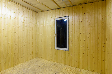 Image showing Walls finished with wooden clapboard in the interior of a country empty house