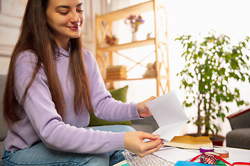 Image showing Woman writing letter, greeting card for New Year and Christmas 2021 for friends or family