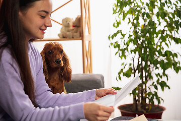 Image showing Woman opening, recieving greeting card for New Year and Christmas 2021 from friends or family