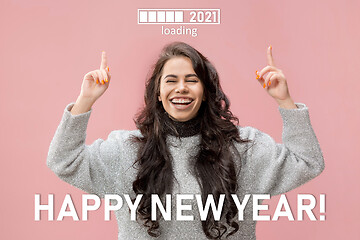Image showing Caucasian young woman\'s portrait isolated on pink studio background, celebrating New 2021 Year and Christmas