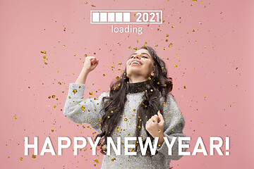 Image showing Caucasian young woman\'s portrait isolated on pink studio background, celebrating New 2021 Year and Christmas