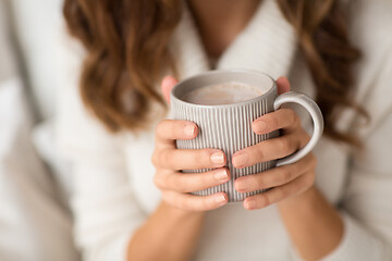 Image showing close up of happy woman with cup of coffee at home