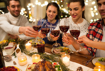 Image showing close up of friends with wine celebrate christmas