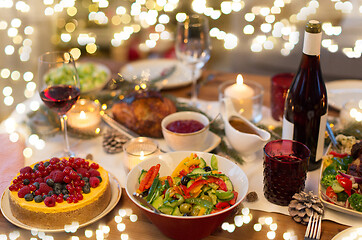 Image showing food and drinks on christmas table at home