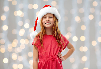 Image showing smiling red haired girl posing in santa helper hat