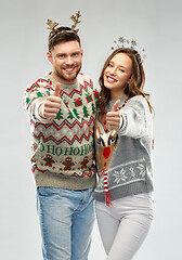 Image showing happy couple at christmas ugly sweater party