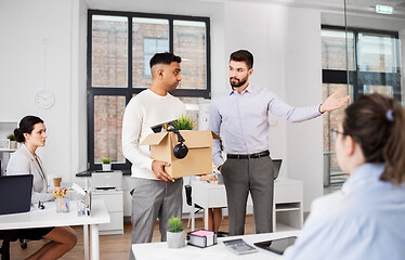 Image showing executive seeing off sad fired male office worker