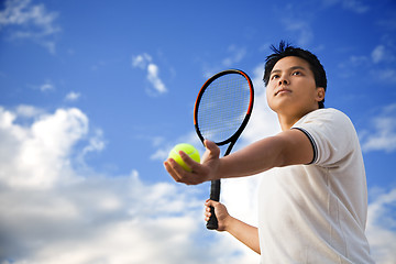 Image showing Asian male playing tennis