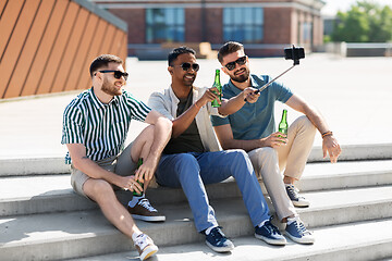 Image showing men toasting beer and taking selfie by smartphone