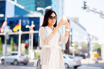 Image showing asian woman taking selfie by smartphone in city