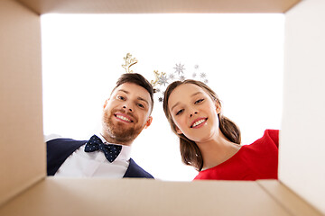 Image showing happy couple opening christmas gift box