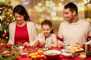 Image showing happy family having christmas dinner at home