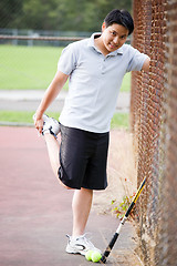 Image showing Young asian male tennis player