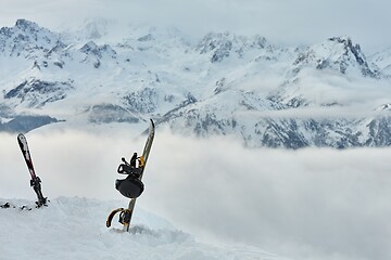 Image showing Snowboard high up in the snowy Alps