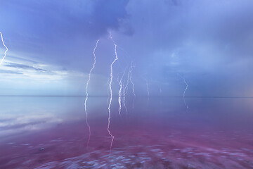 Image showing Thunderstorm over the pink lake with extremely salted water.