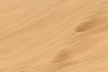 Image showing Yellow desert sand with footprints on it.